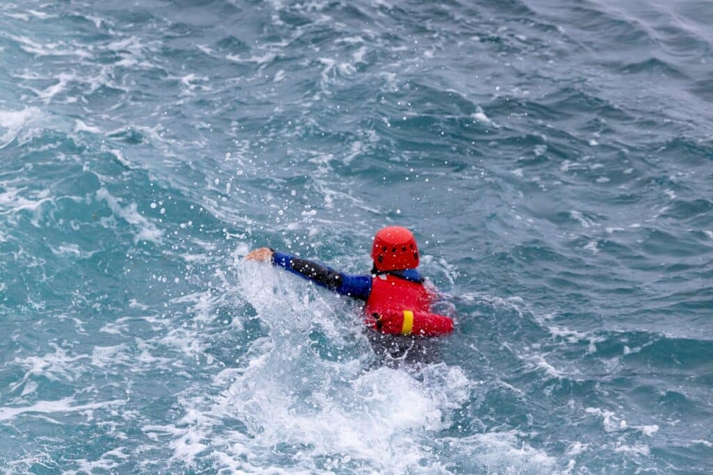 A woman coasteering