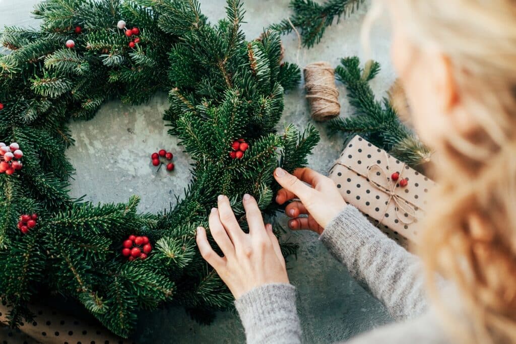 Lady makes a Christmas wreath