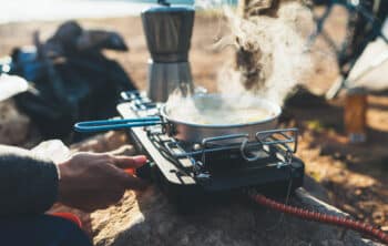 Person using a camping stove